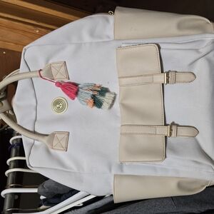 Stylish Cream Backpack with Tassel Accent